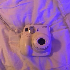 White Fufifilm instant camera (Polaroid)